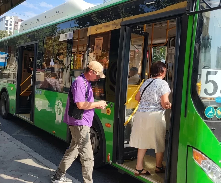 Passengers boarding an electric bus